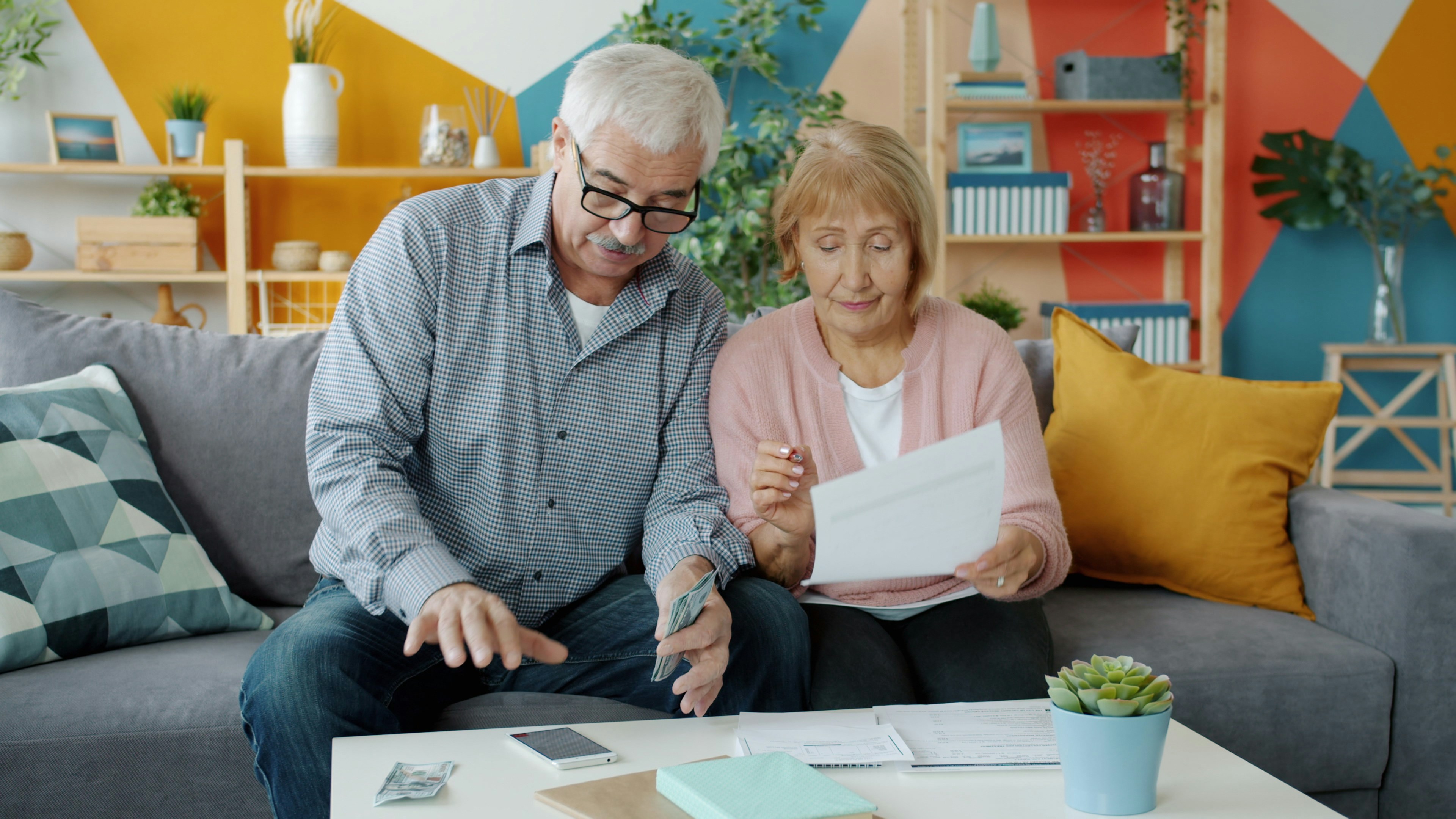 couple reviewing retirement documents at home